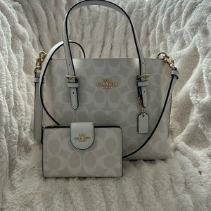 Slightly used small Coach bag and small wallet.
